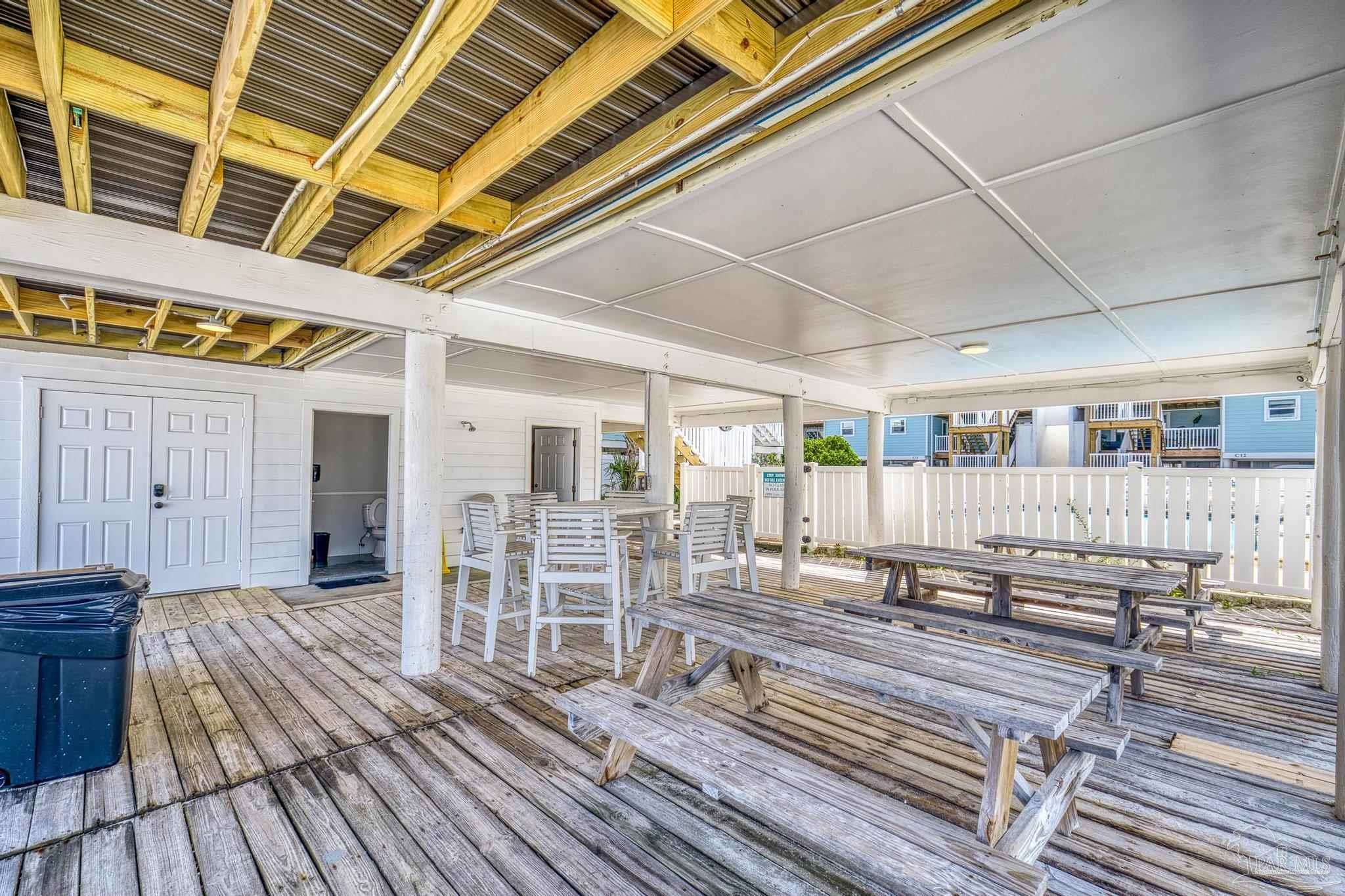 1100 Fort Pickens Road, Unit A13 Pensacola Beach, FL 32561 - Photo 51 of 63 a view of a patio with wooden floor
