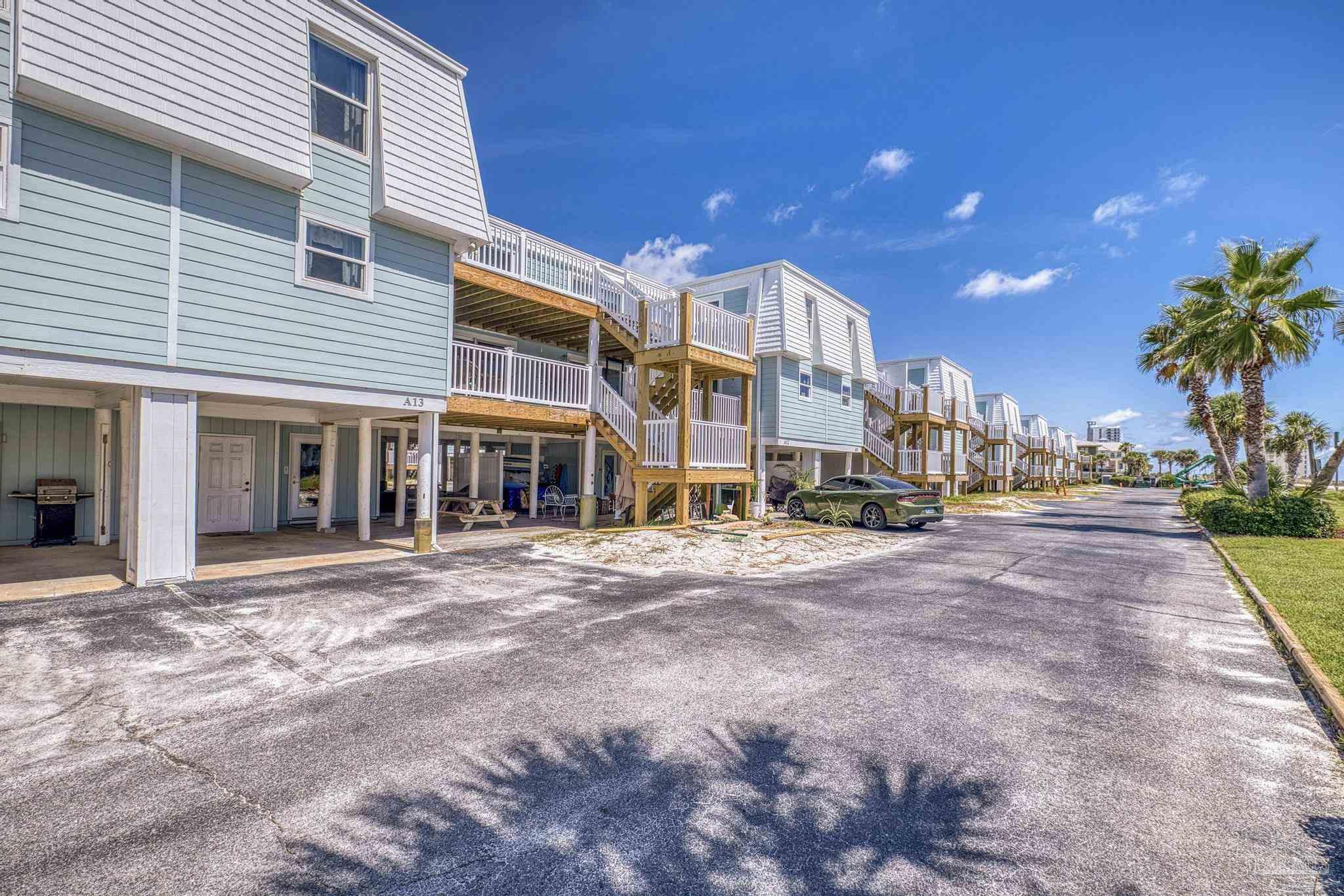 1100 Fort Pickens Road, Unit A13 Pensacola Beach, FL 32561 - Photo 6 of 63 a view of a building with a street