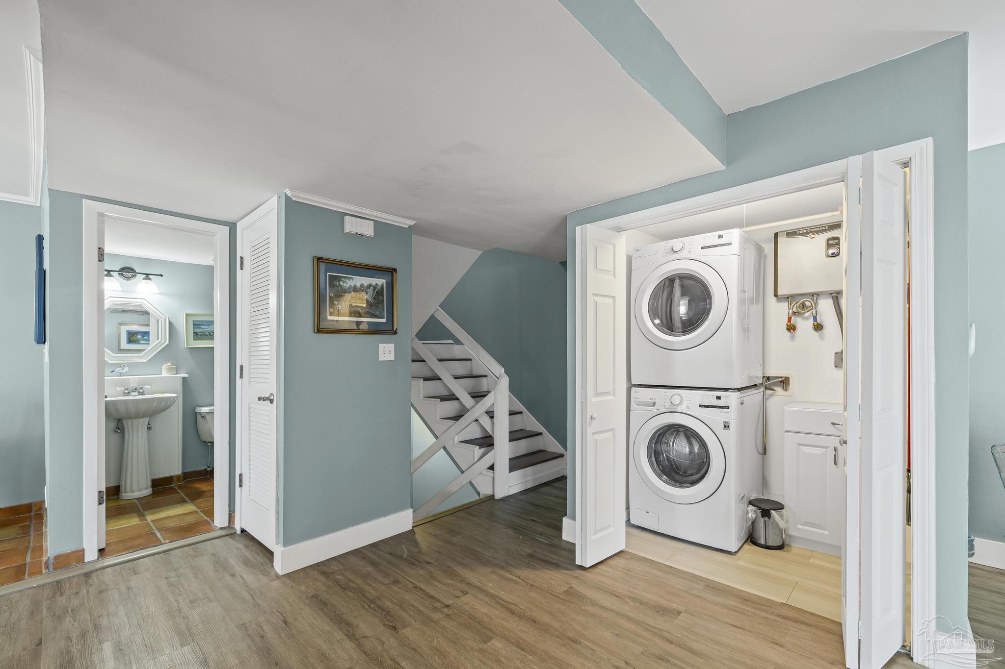 1100 Fort Pickens Road, Unit A13 Pensacola Beach, FL 32561 - Photo 10 of 63 a utility room with dryer and washer