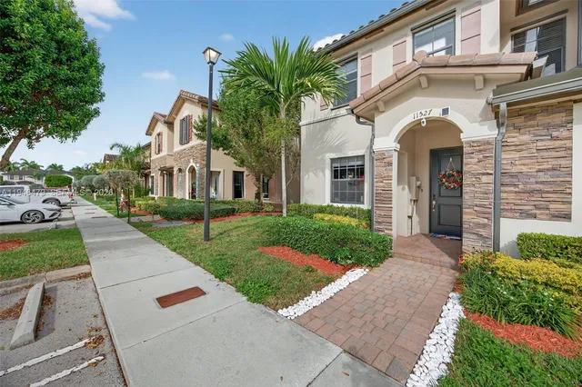 front view of a house with a yard
