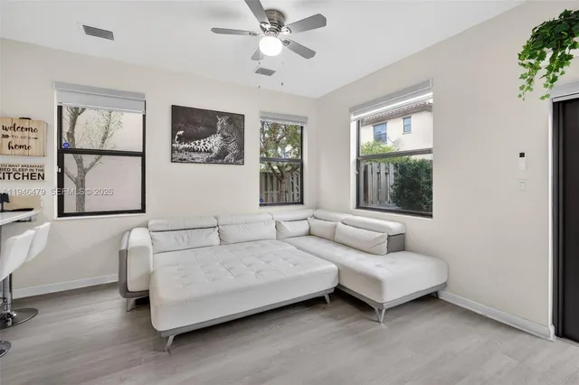 a living room with furniture and a window