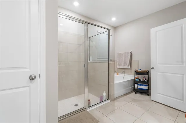 a bathroom with a shower and a sink