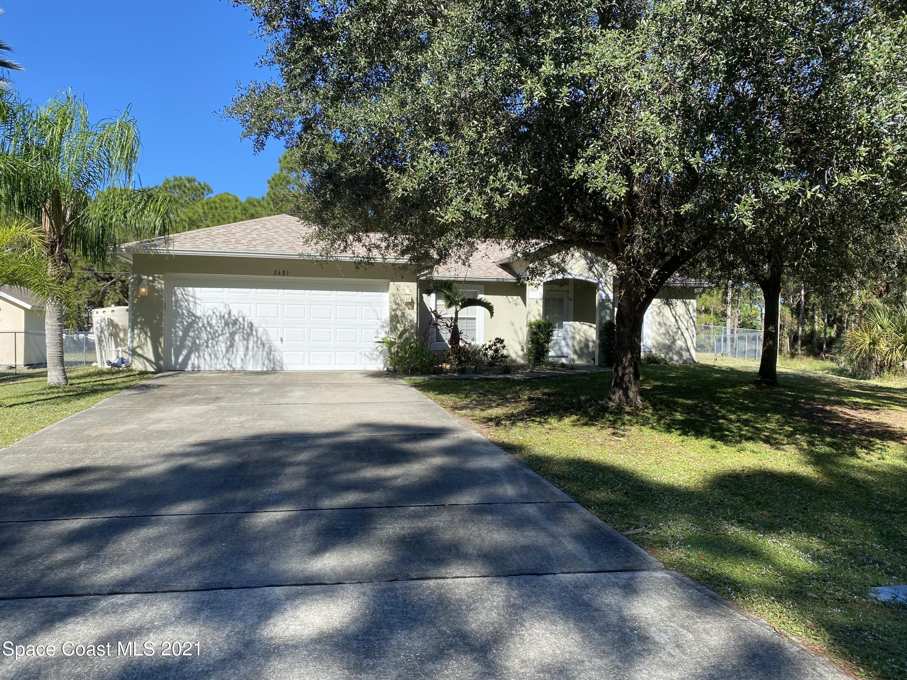 2481 Anchor Road Southeast Palm Bay, FL 32909 - Photo 1 of 32 a view of a house with yard and tree s