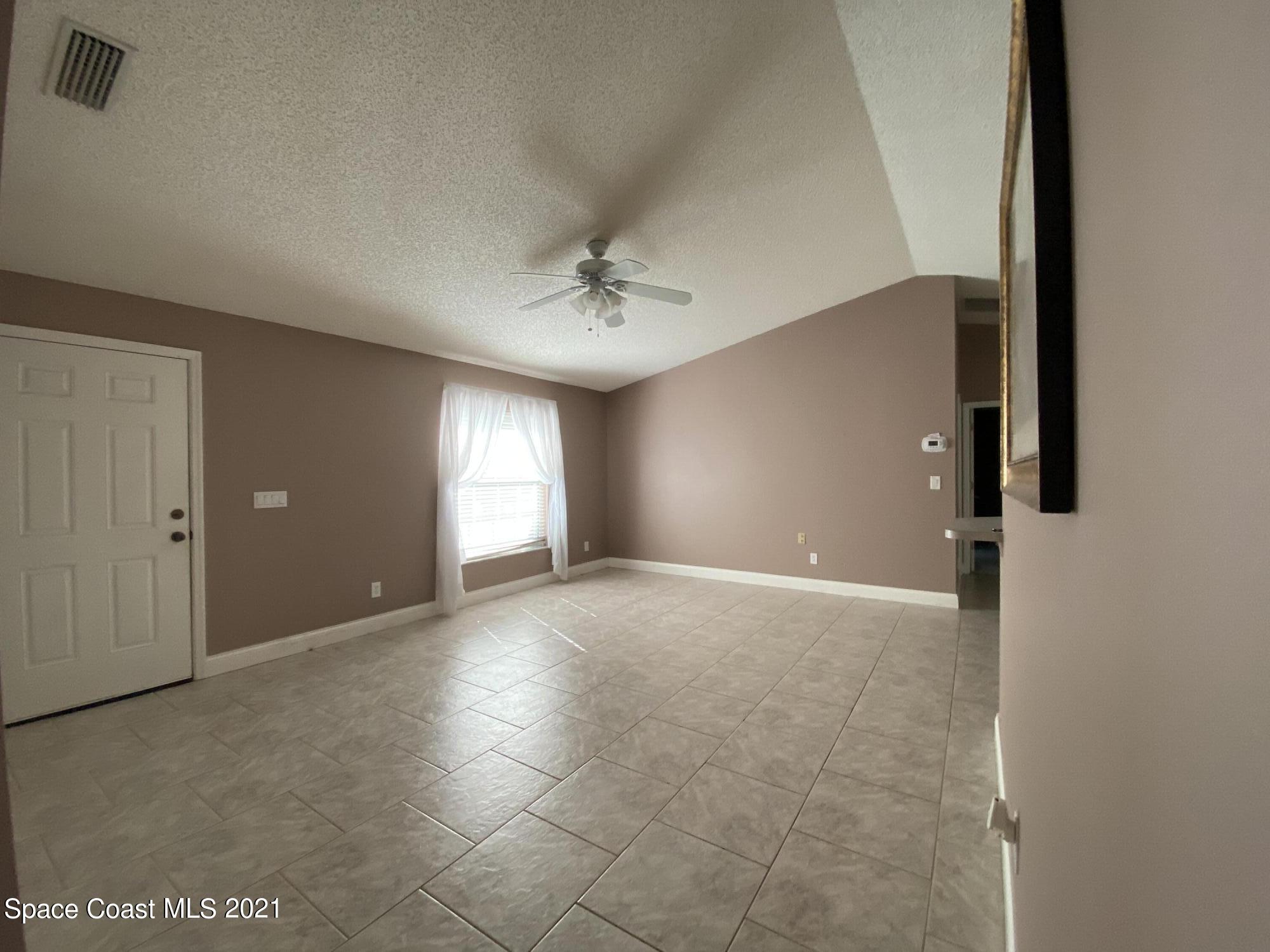2481 Anchor Road Southeast Palm Bay, FL 32909 - Photo 14 of 32 a view of an empty room with a window