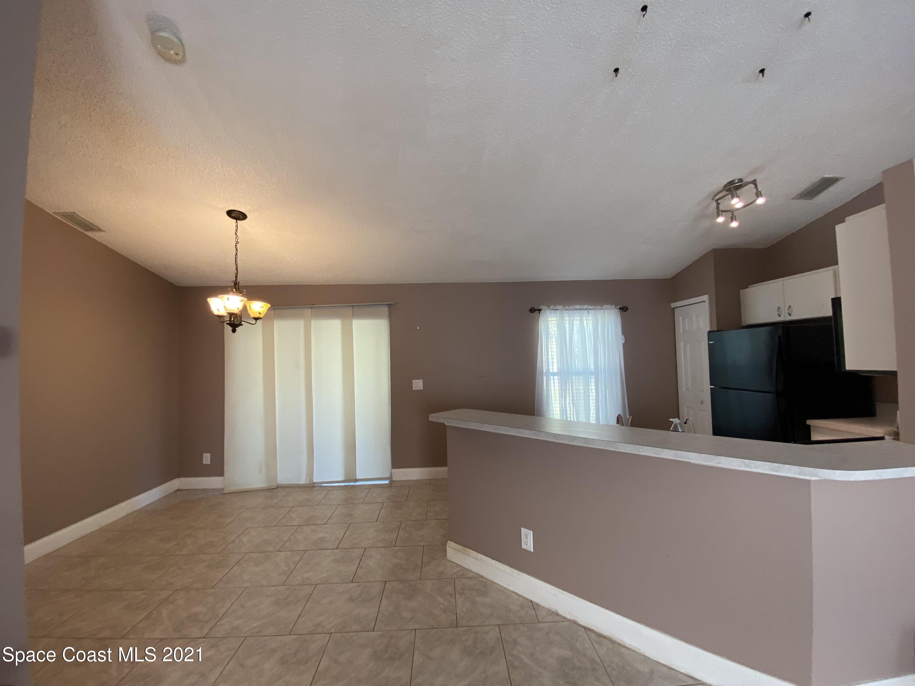 2481 Anchor Road Southeast Palm Bay, FL 32909 - Photo 18 of 32 a view of a livingroom with a fireplace