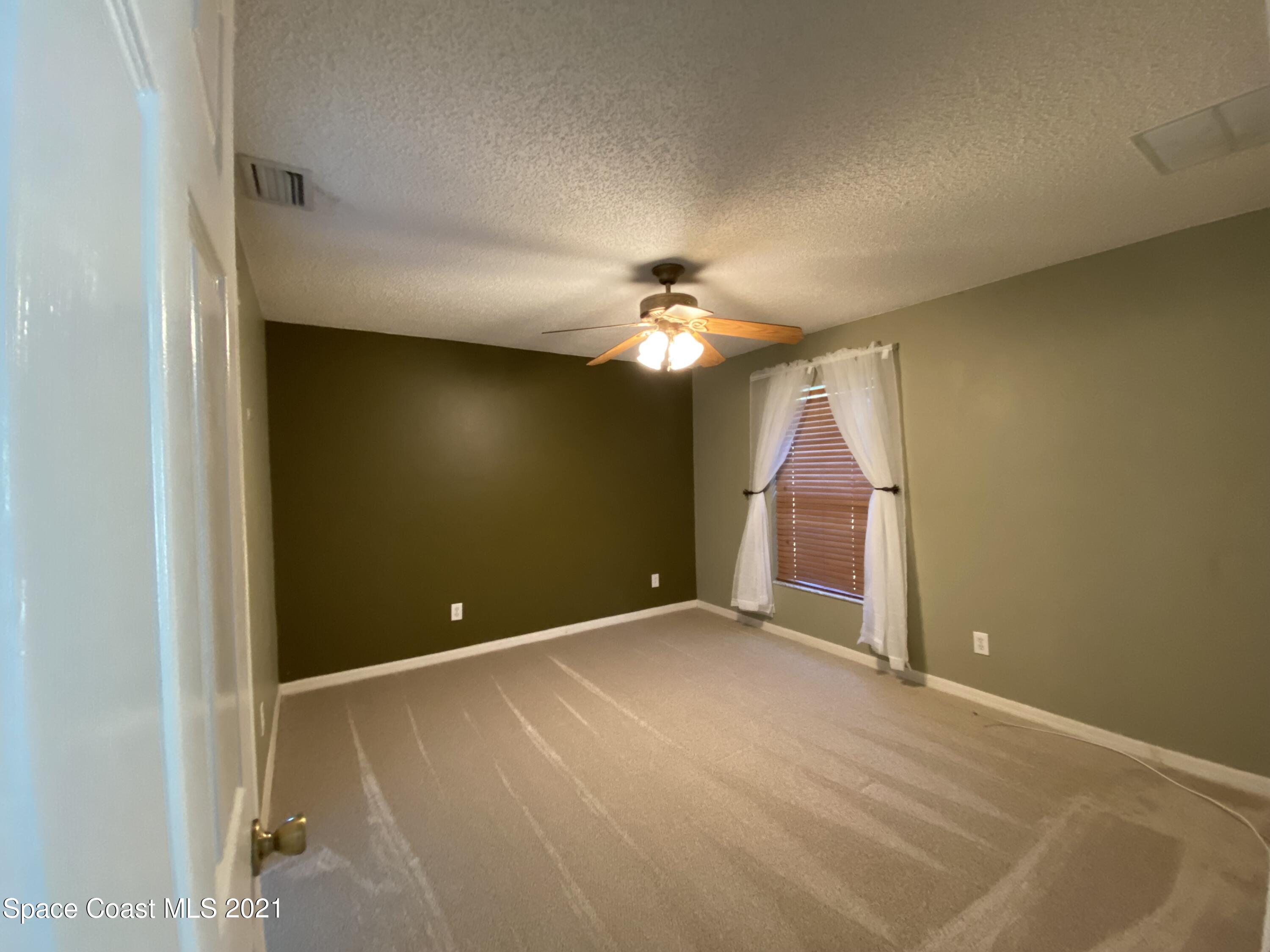2481 Anchor Road Southeast Palm Bay, FL 32909 - Photo 23 of 32 a view of empty room with window