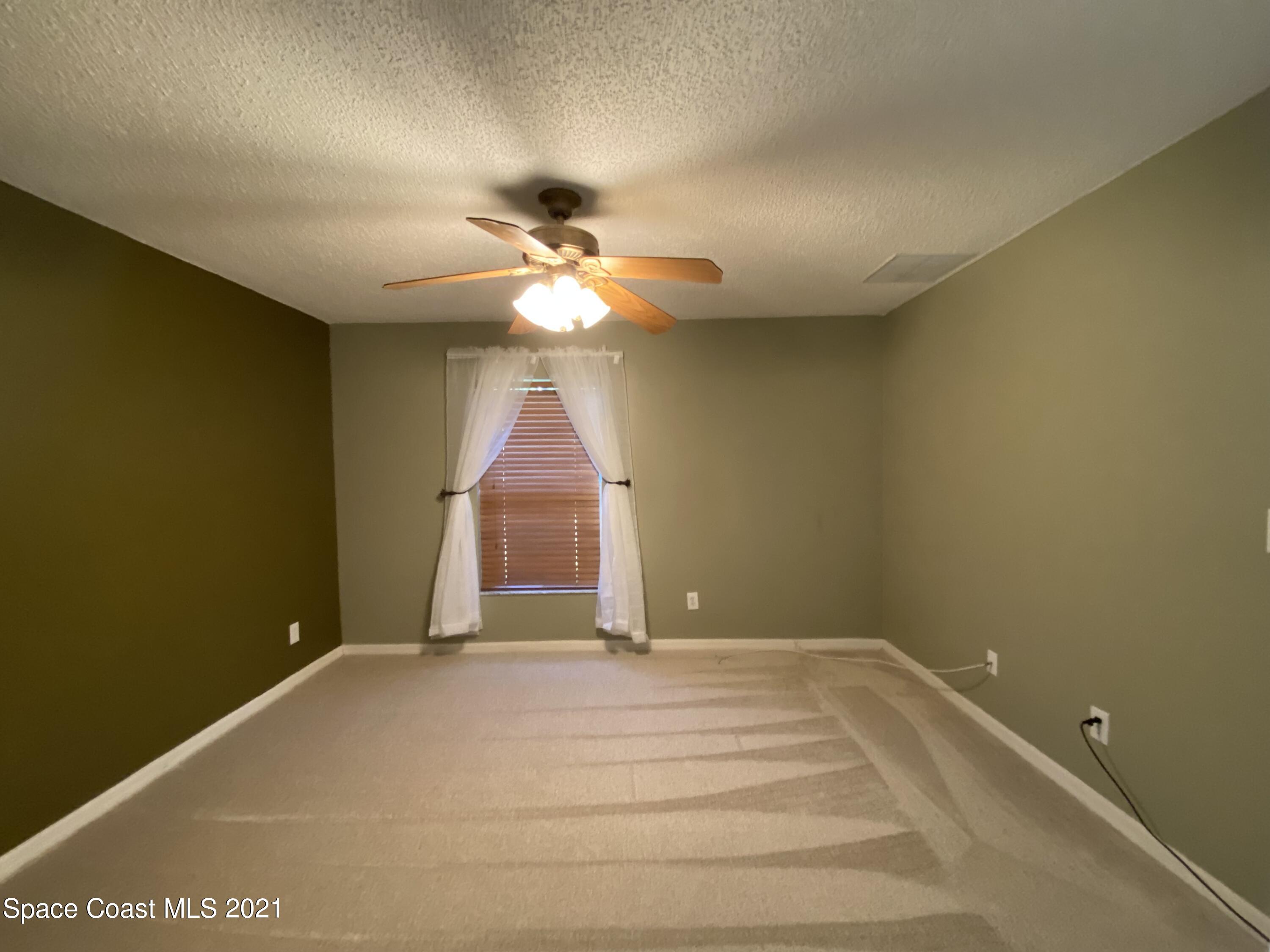 2481 Anchor Road Southeast Palm Bay, FL 32909 - Photo 24 of 32 wooden floor in an empty room