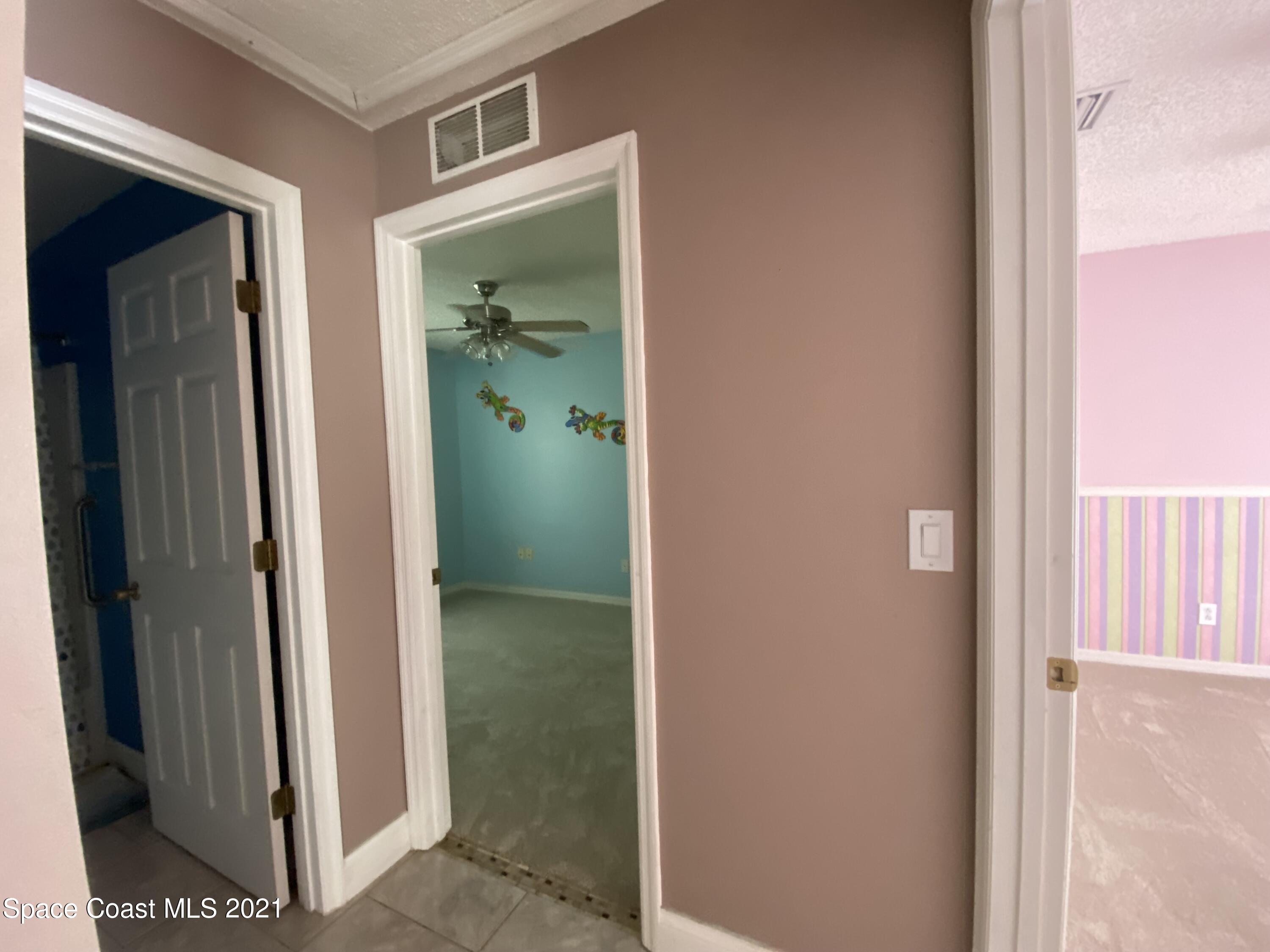 2481 Anchor Road Southeast Palm Bay, FL 32909 - Photo 27 of 32 a view of a bathroom from a corridor