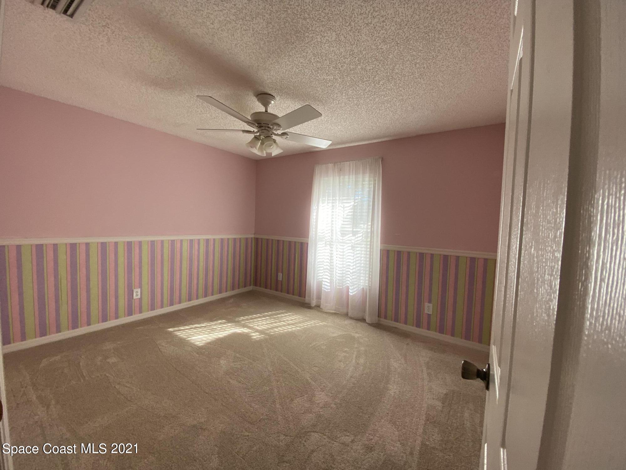 2481 Anchor Road Southeast Palm Bay, FL 32909 - Photo 28 of 32 a view of an empty room with a window