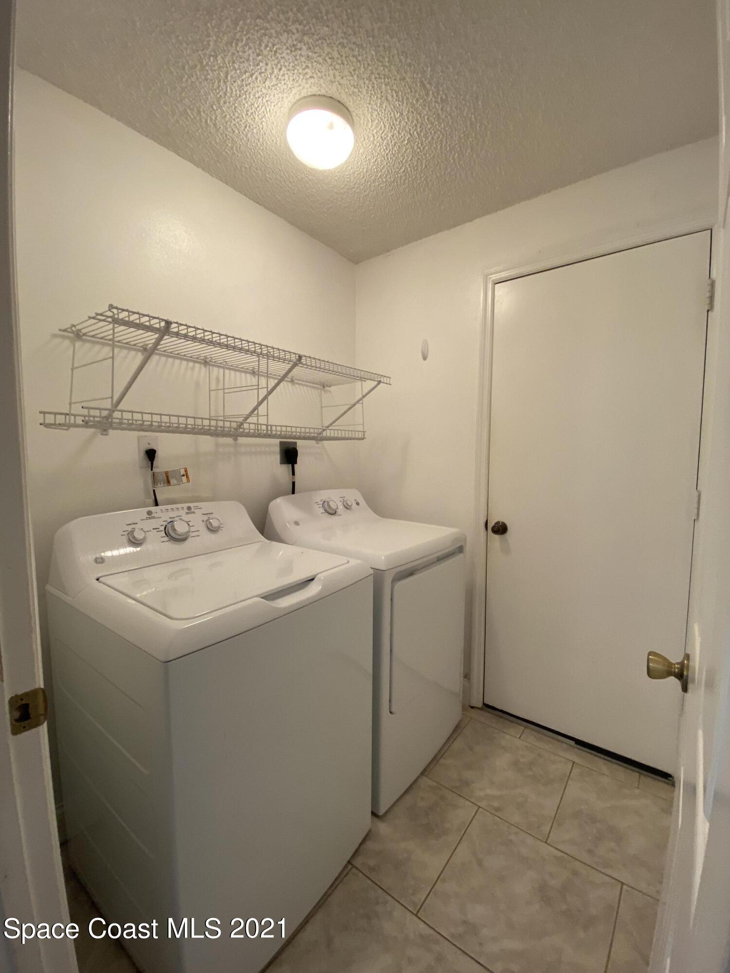 2481 Anchor Road Southeast Palm Bay, FL 32909 - Photo 32 of 32 a utility room with dryer and washer