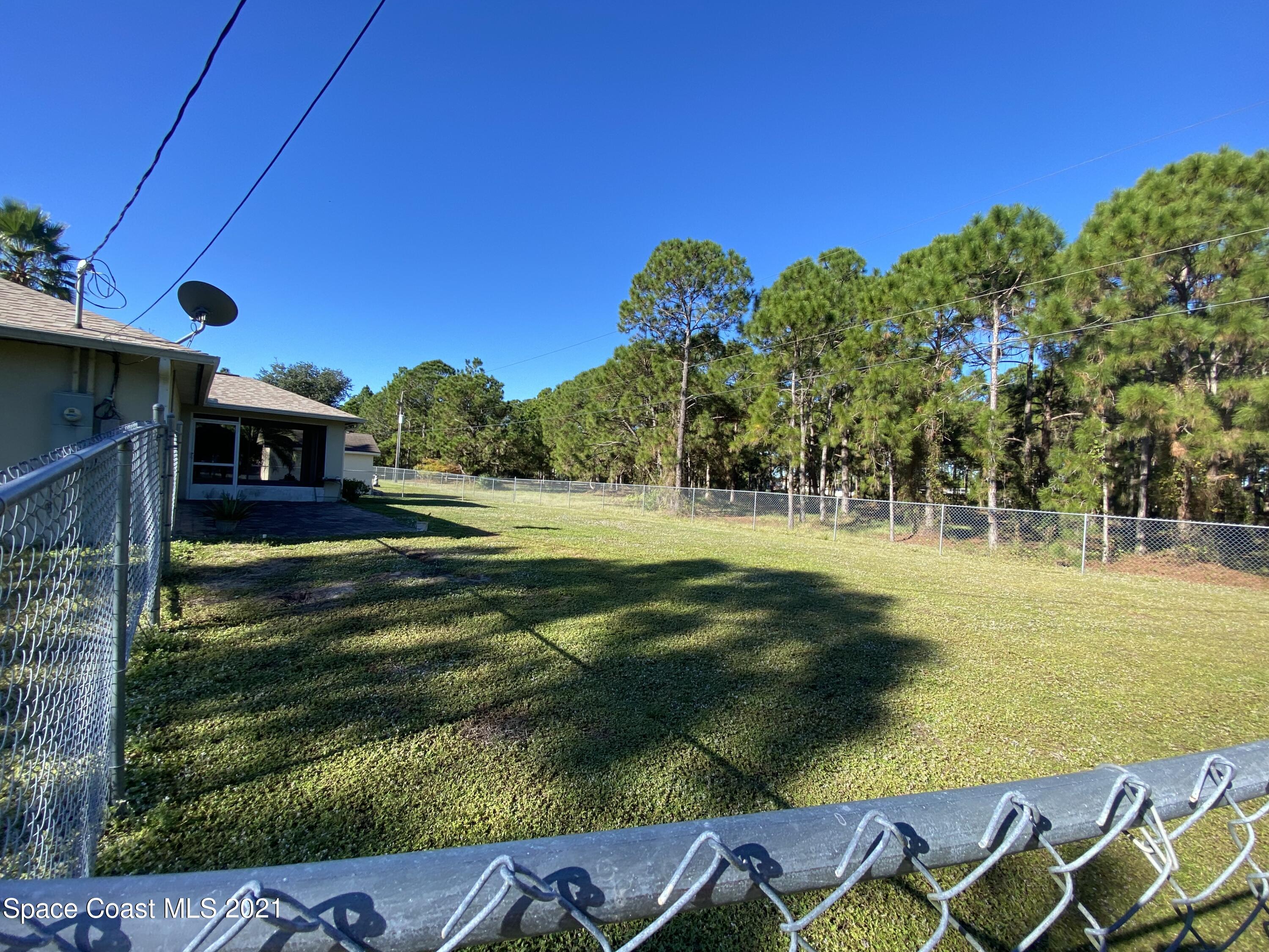 2481 Anchor Road Southeast Palm Bay, FL 32909 - Photo 6 of 32 a view of swimming pool with a yard