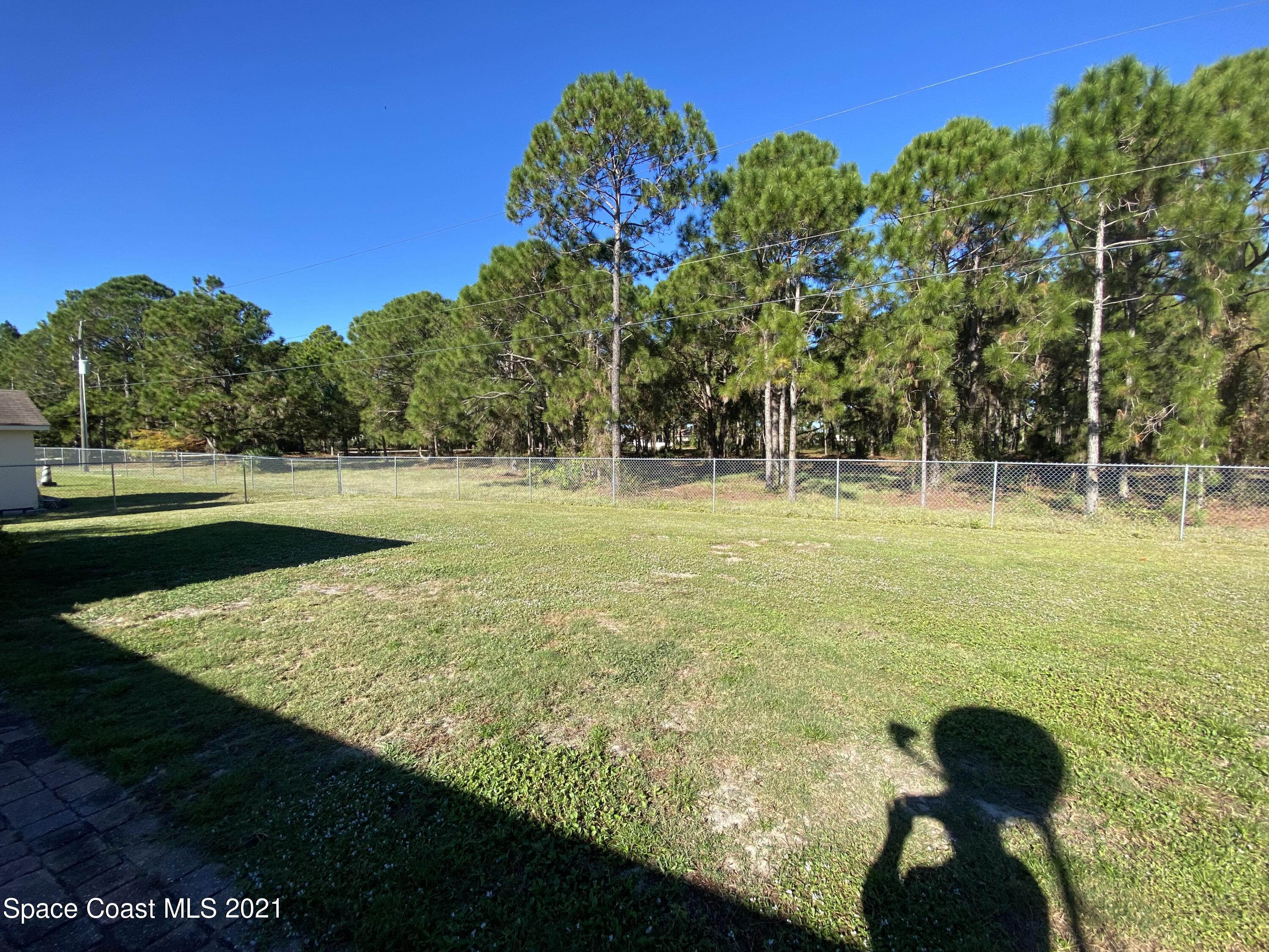 2481 Anchor Road Southeast Palm Bay, FL 32909 - Photo 7 of 32 a view of a golf ground with huge green field and trees