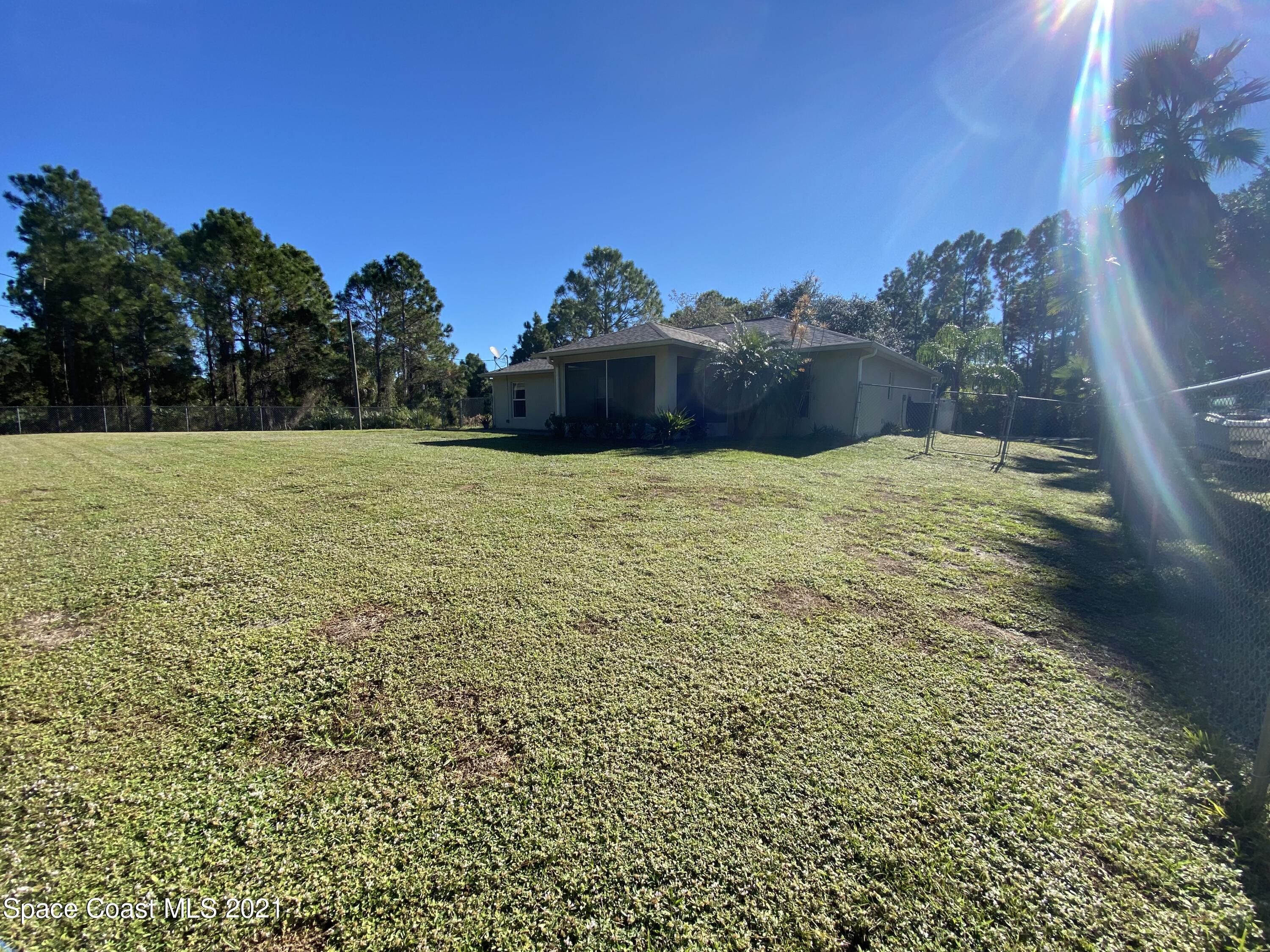 2481 Anchor Road Southeast Palm Bay, FL 32909 - Photo 10 of 32 a big yard with lots of green space