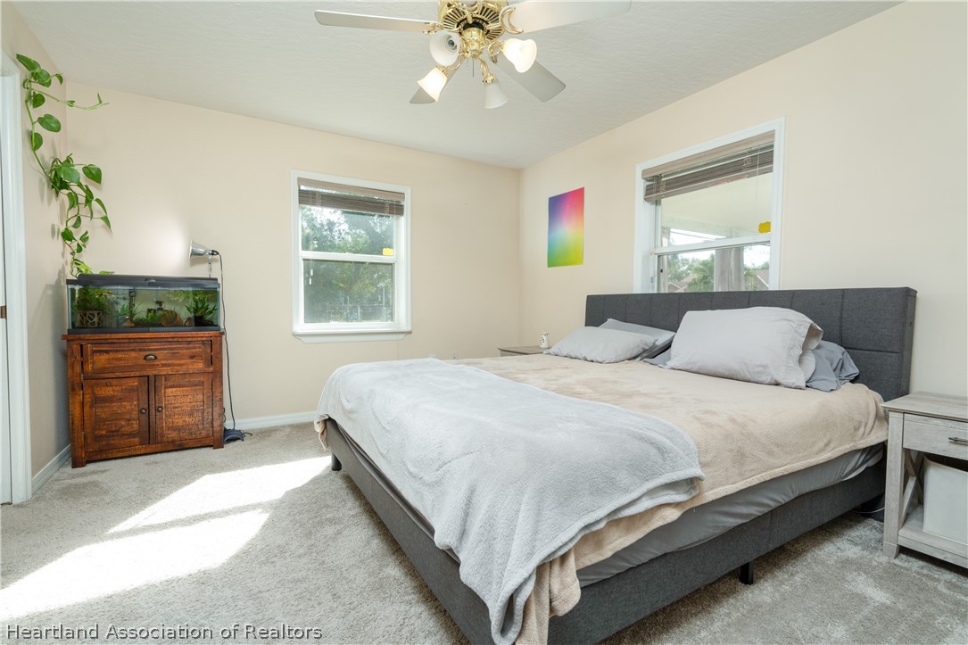 4021 Loquat Road Sebring, FL 33875 - Photo 11 of 26 a bedroom with a bed dresser and a window