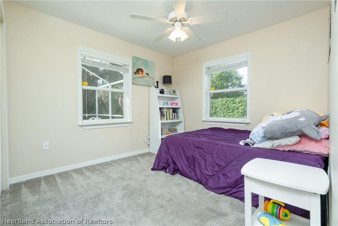 4021 Loquat Road Sebring, FL 33875 - Photo 14 of 26 a bedroom with a bed and a window