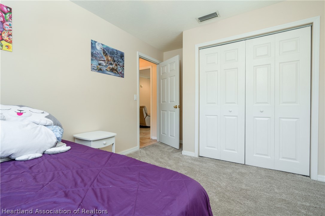 4021 Loquat Road Sebring, FL 33875 - Photo 15 of 26 a bedroom with a bed and a window
