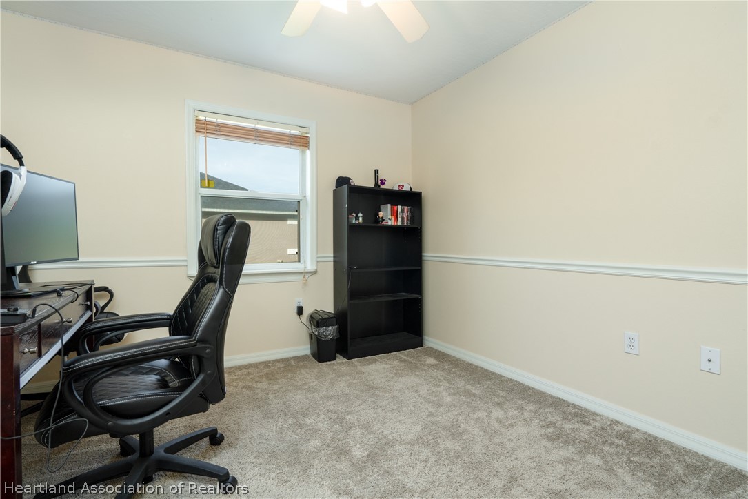 4021 Loquat Road Sebring, FL 33875 - Photo 17 of 26 a view of a workspace with furniture and closet