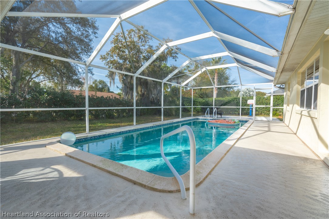 4021 Loquat Road Sebring, FL 33875 - Photo 19 of 26 a view of a house with a swimming pool