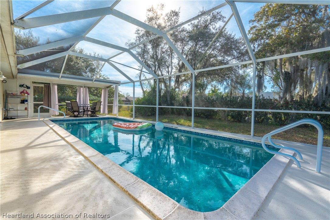 4021 Loquat Road Sebring, FL 33875 - Photo 20 of 26 a view of a house with a backyard