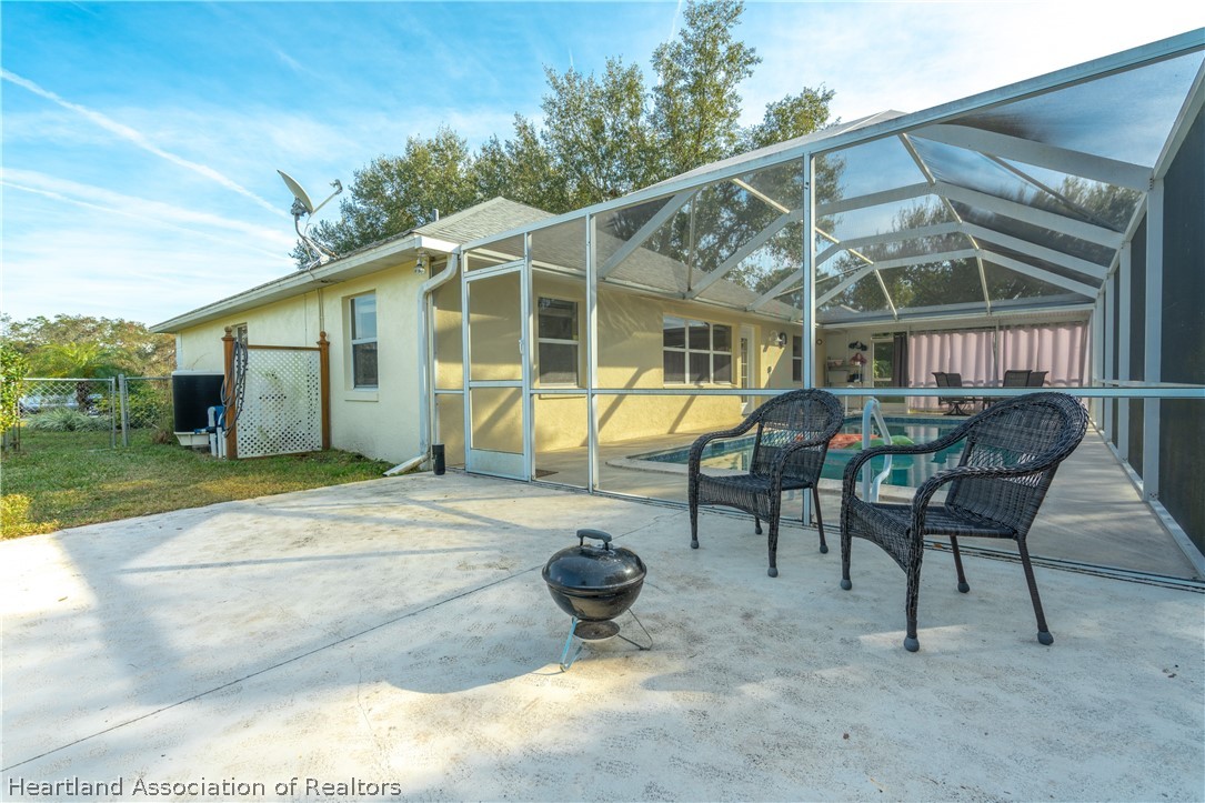 4021 Loquat Road Sebring, FL 33875 - Photo 22 of 26 a view of a house with backyard