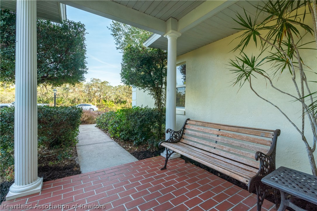 4021 Loquat Road Sebring, FL 33875 - Photo 3 of 26 a bench sitting in front of a house