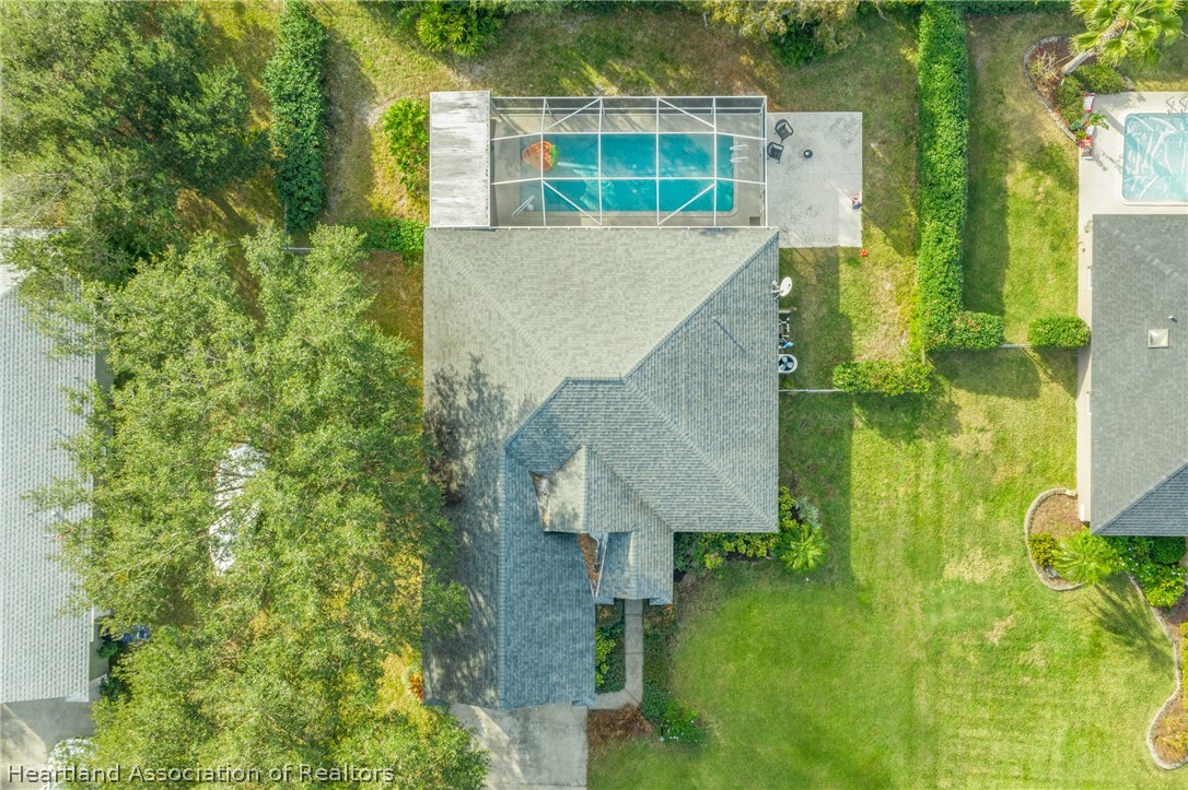 4021 Loquat Road Sebring, FL 33875 - Photo 4 of 26 an aerial view of residential houses with outdoor space and trees