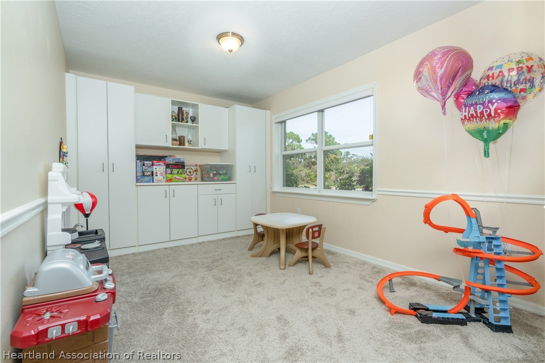 4021 Loquat Road Sebring, FL 33875 - Photo 9 of 26 a view of a room with gym equipment