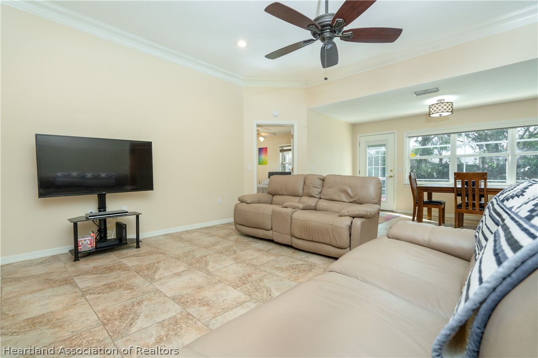 4021 Loquat Road Sebring, FL 33875 - Photo 10 of 26 a living room with furniture and a flat screen tv