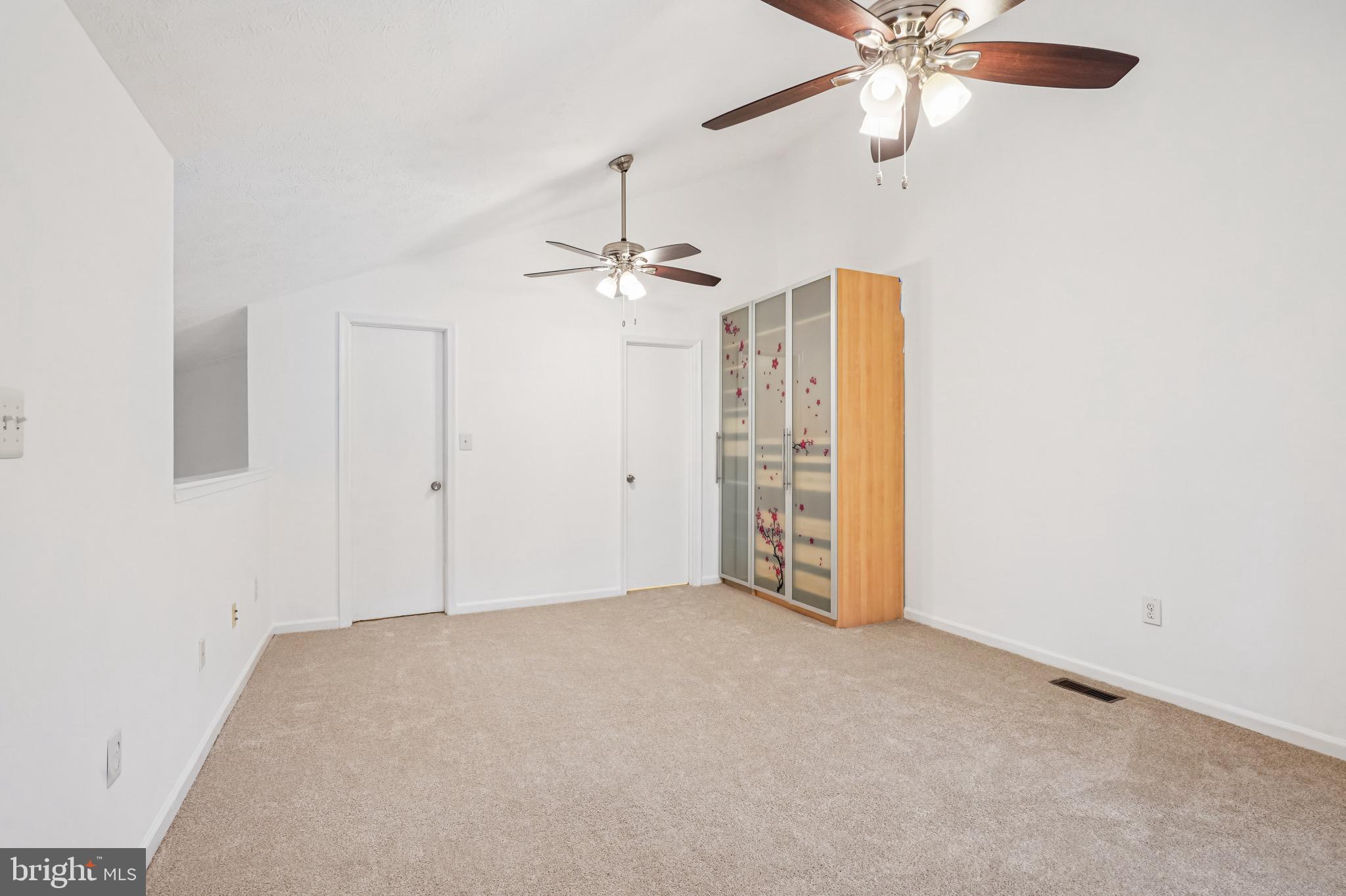 2203 Hunter's Run Drive Reston, VA 20191 - Photo 17 of 48 en empty room with windows and fan