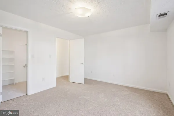 a view of a hallway with stairs