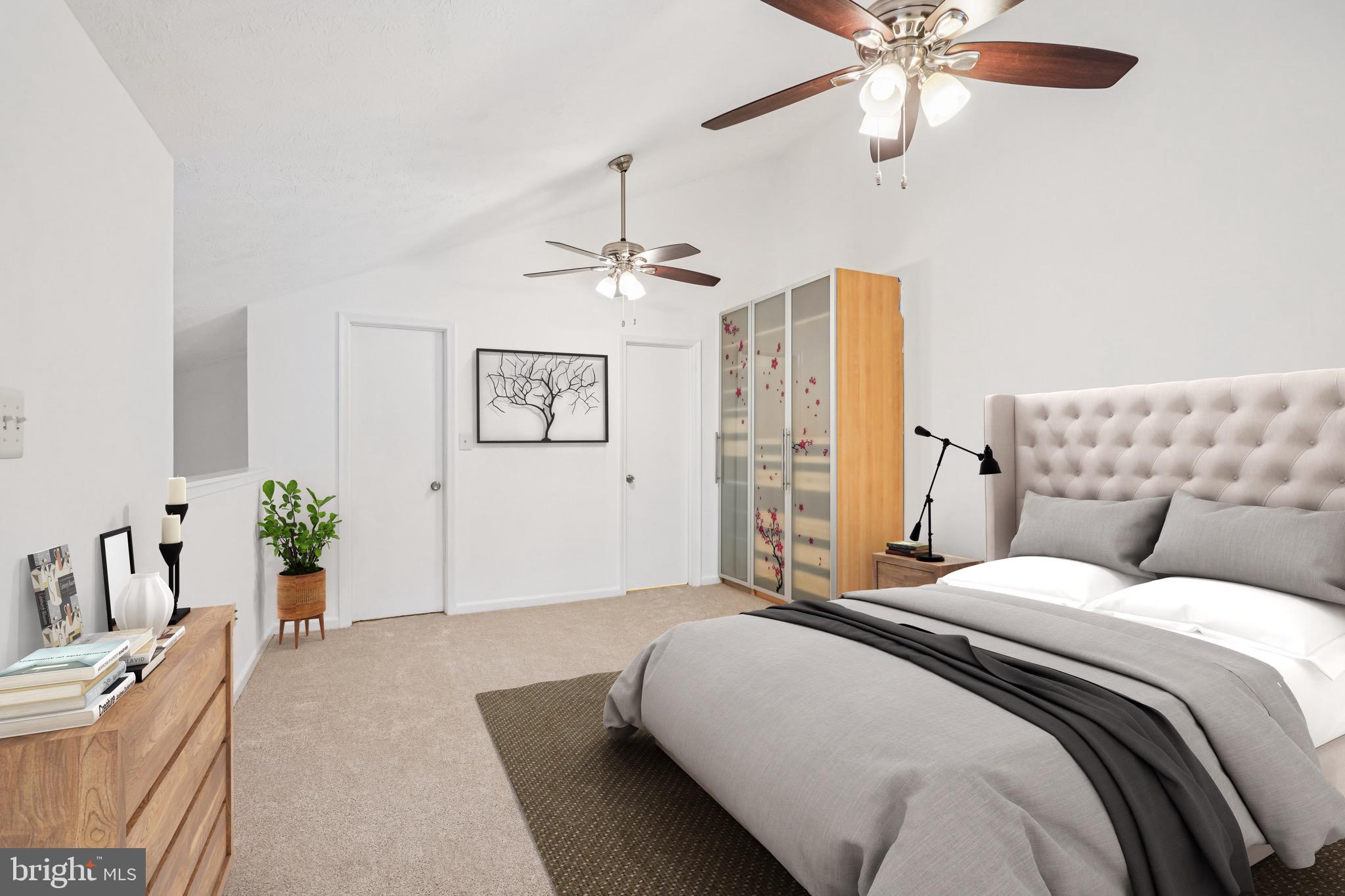 2203 Hunter's Run Drive Reston, VA 20191 - Photo 2 of 48 a spacious bedroom with a bed and ceiling fan