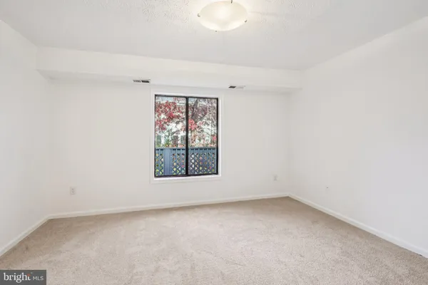 a bathroom with a sink mirror vanity and toilet