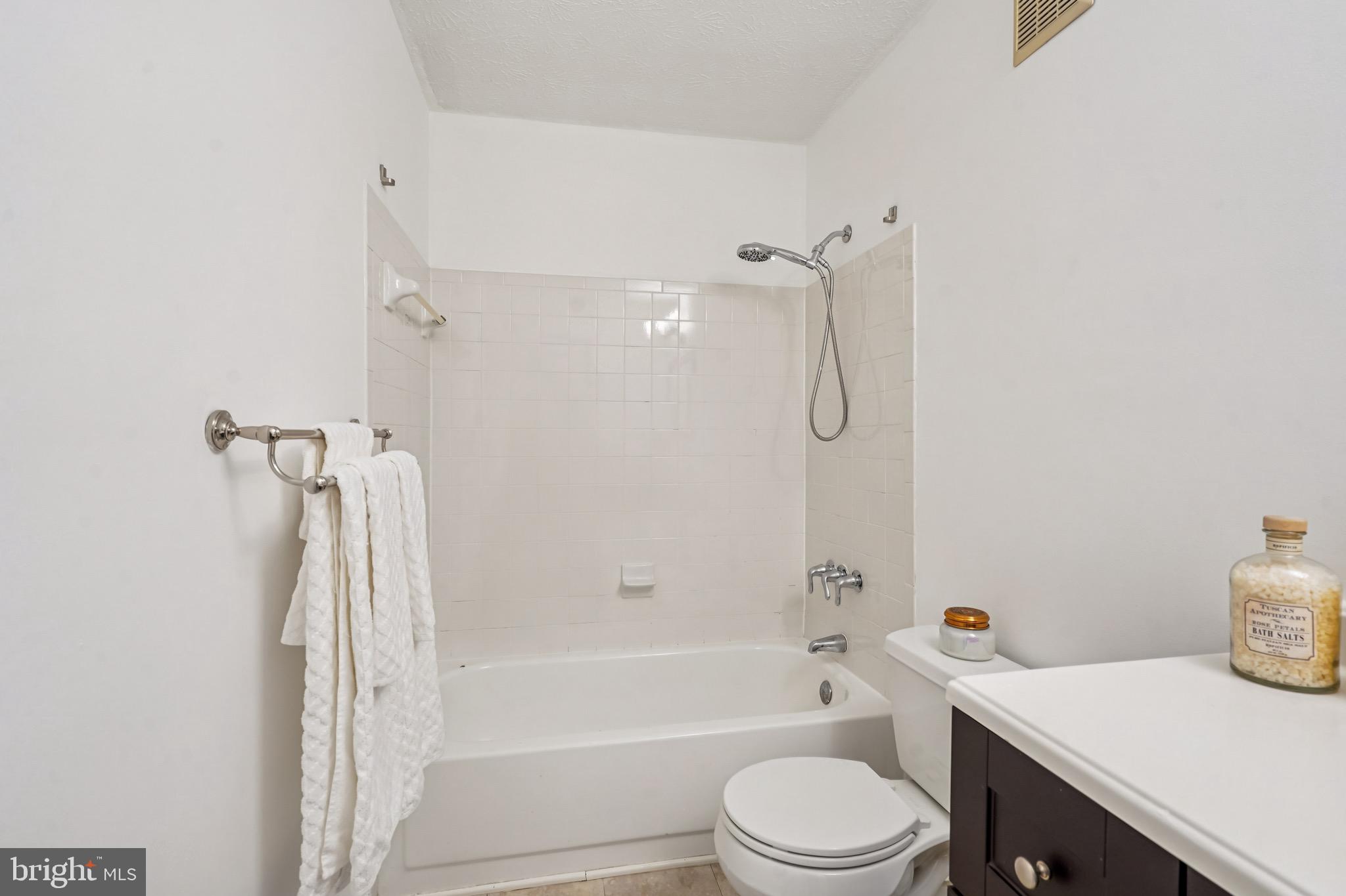 2203 Hunter's Run Drive Reston, VA 20191 - Photo 26 of 48 a bathroom with a sink a toilet and a bathtub