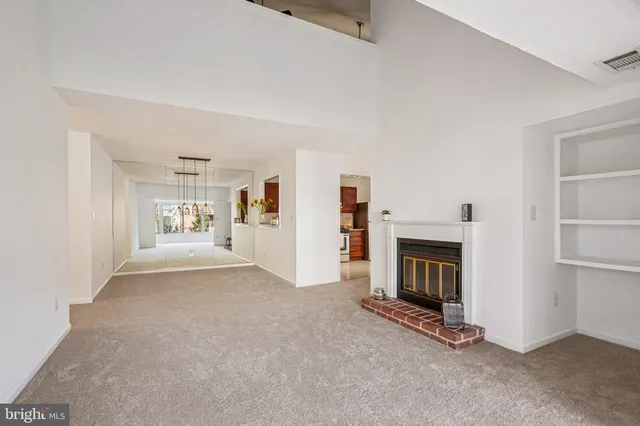 a kitchen with stainless steel appliances granite countertop a refrigerator stove and sink