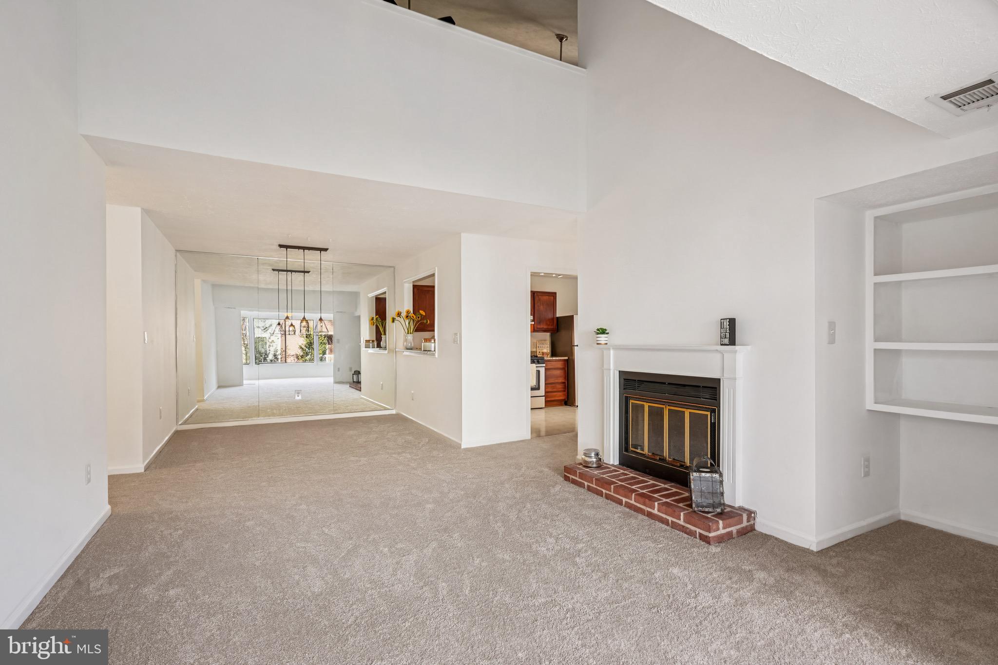 2203 Hunter's Run Drive Reston, VA 20191 - Photo 4 of 48 a view of a livingroom with a fireplace and workspace