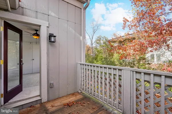 a view of room with window and ceiling fan
