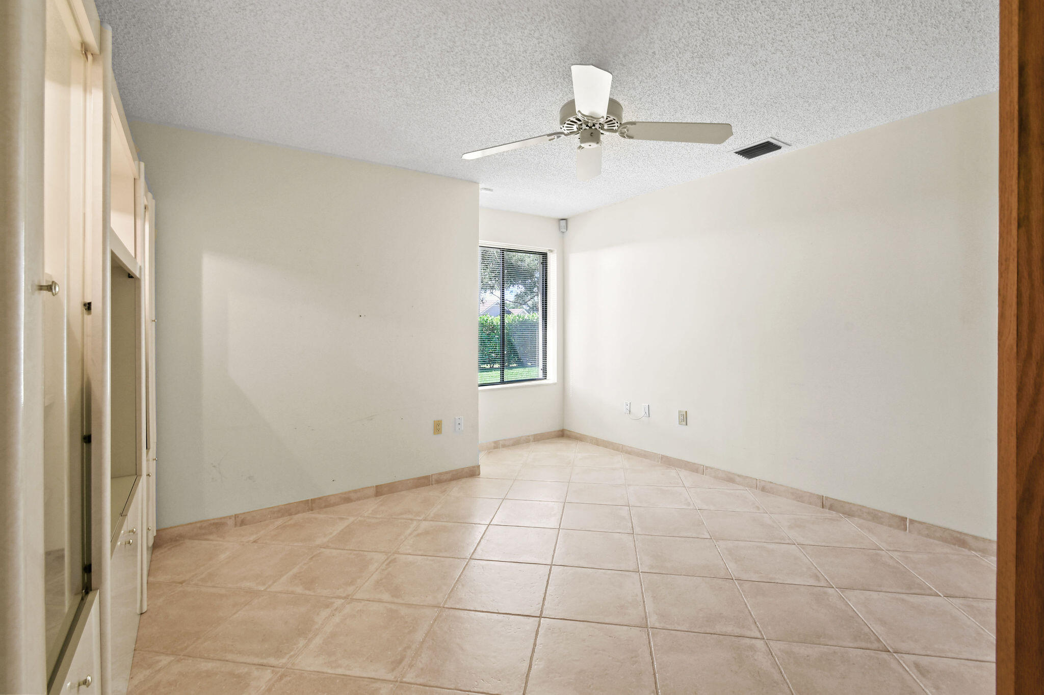 247 Ridge Road Jupiter, FL 33477 - Photo 19 of 28 a view of an empty room with a window