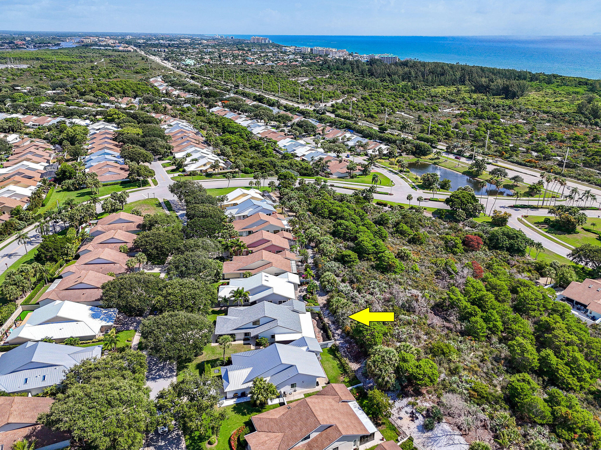 247 Ridge Road Jupiter, FL 33477 - Photo 26 of 28 an aerial view of residential houses with outdoor space and trees