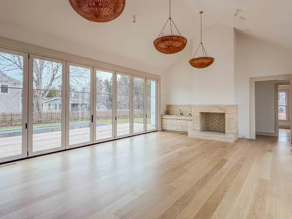 a view of a room with wooden floor