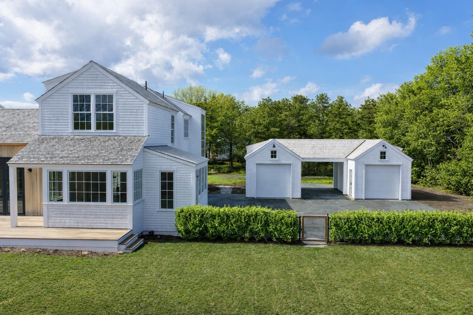 2 Lexington Avenue Edgartown, MA 02539 - Photo 3 of 41 a front view of a house with a yard and garage