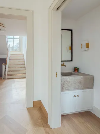 a view of a room that has a table and chairs in it