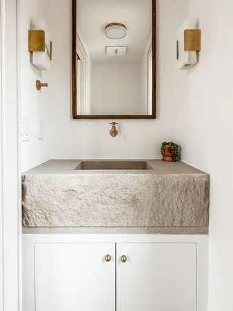 an empty room with fan and windows