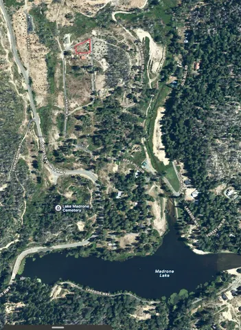 a view of a park with iron fence