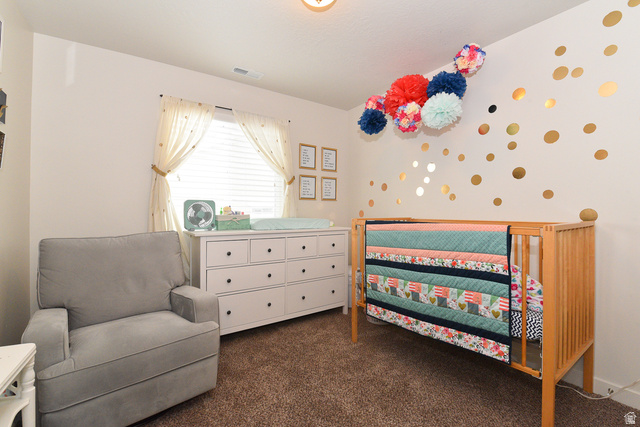 1632 North Apache Road Saratoga Springs, UT 84045 - Photo 21 of 28 Carpeted room featuring a window with blinds, a built-in ceiling light fixture, a white dresser with dark hardware, and light-toned walls