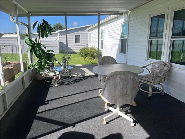 a table and chairs in a patio