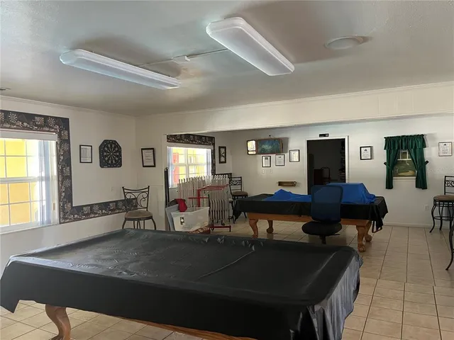 a living room with furniture and large window