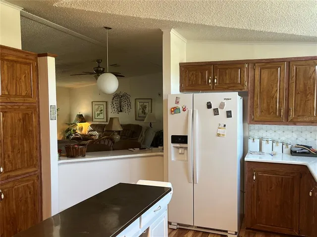 a kitchen with stainless steel appliances a refrigerator and a stove