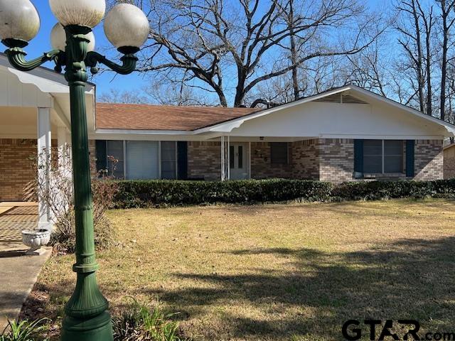 216 Arch Davis Road Pittsburg, TX 75686 - Photo 1 of 20 a front view of house with yard and trees