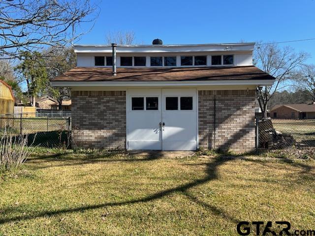 216 Arch Davis Road Pittsburg, TX 75686 - Photo 19 of 20 a front view of a house with a yard