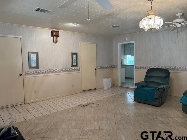 216 Arch Davis Road Pittsburg, TX 75686 - Photo 6 of 20 a living room with furniture and a chandelier